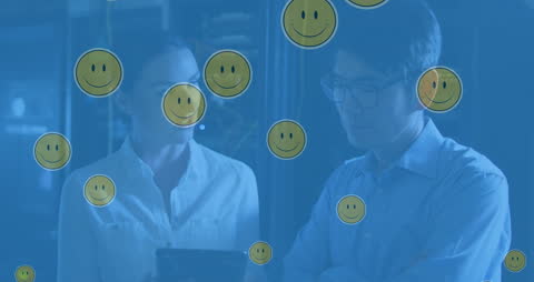 Diverse IT Professionals with Smiley Icon Overlay in Data Center