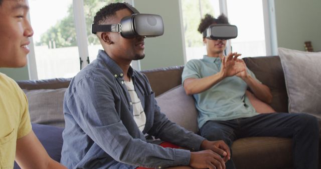 Friends Using Virtual Reality Headsets During Indoor Gaming Session - Download Free Stock Images Pikwizard.com