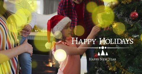 Family Decorating Christmas Tree with Lights and Santa Hats