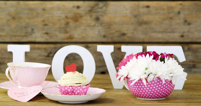 Celebrating Love with Cupcake, Tea, and Flowers on Rustic Wood - Download Free Stock Images Pikwizard.com