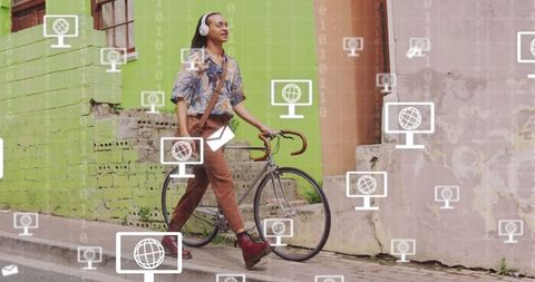 Man walking with bike surrounded by digitally enhanced icons