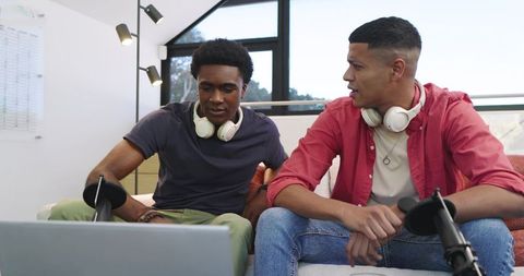 Diverse Friends Collaborating on Podcast in Home Studio