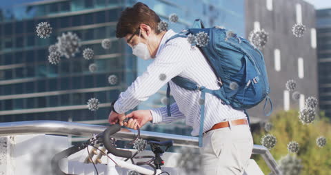 Man With Mask Locks Bicycle Amid COVID-19 Pandemic