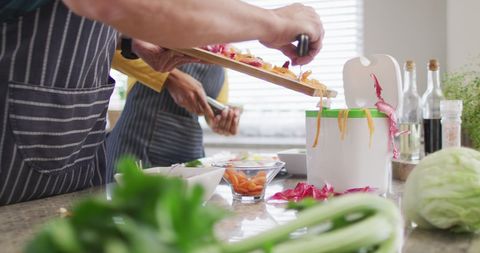 Couple Enjoying Meal Prep and Wine in Modern Kitchen