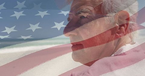 Senior Man Reflecting on Beach with United States Flag Overlay