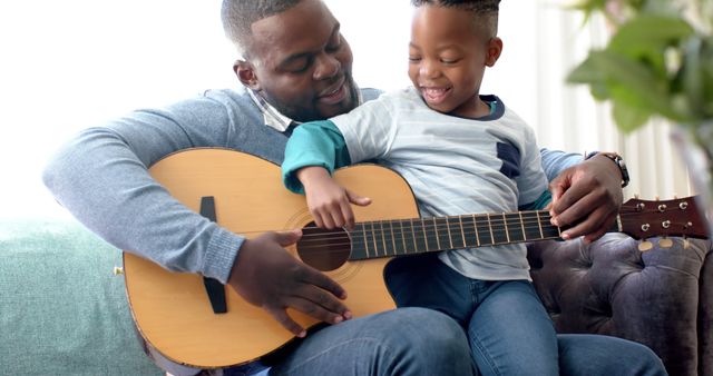 Father Teaching Son How to Play Guitar at Home - Download Free Stock Images Pikwizard.com