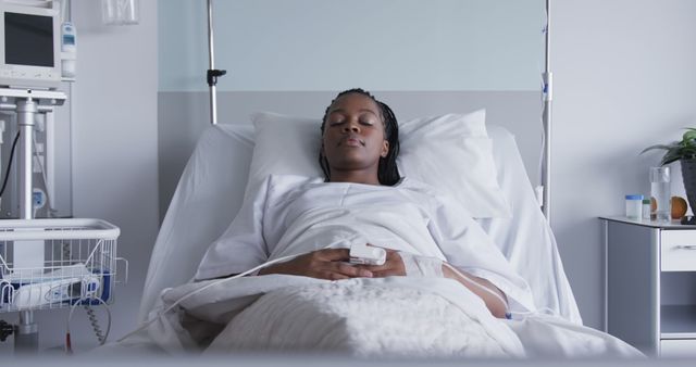 Young Woman Resting in Hospital Bed with Medical Equipment - Download Free Stock Images Pikwizard.com