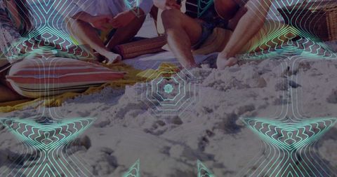 Friends sitting and leaning on beach cushions with turquoise geometric overlay