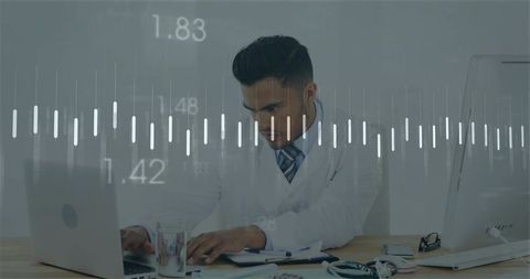 Doctor analyzing digital patient data on laptop in clinic office with stethoscope and charts