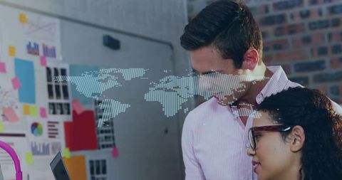 Creative Coworkers Examining Digital Map in Technology Workspace