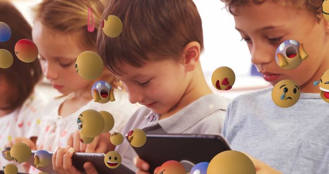 Happy Children Playing With Tablets Surrounded by Emojis - Download Free Stock Images Pikwizard.com