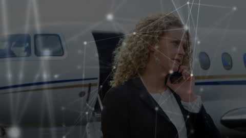 Businesswoman Using Smartphone at Private Jet with Digital Network
