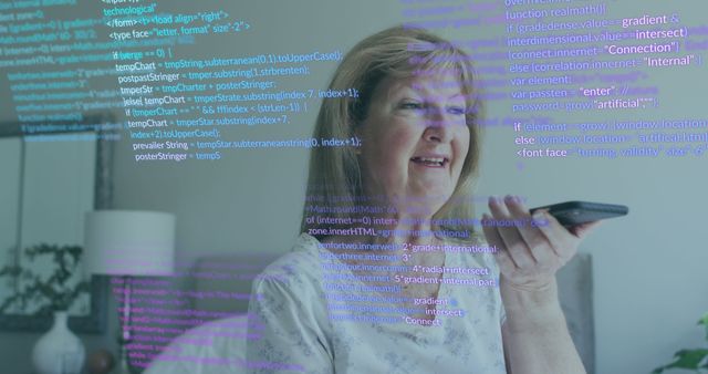 Senior woman using voice command technology with holographic code overlay indicating interaction with smart devices. Shows modern lifestyle, user interface interaction and elderly's integration with advanced technology. Useful for articles about smart homes, AI usage among elderly, and tech accessibility.