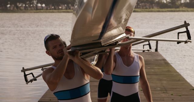 Team of Rowers Carrying Boat on Dock - Download Free Stock Images Pikwizard.com