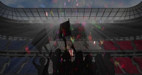 Silhouetted Fans Celebrating Victory in Stadium with Confetti