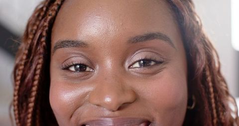 Close-Up Portrait of Smiling African American Woman Showing Natural Beauty
