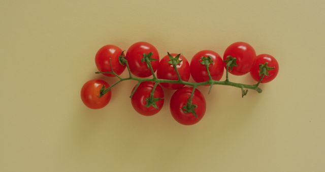 Image of fresh cherry tomatoes with copy space on yellow background - Download Free Stock Photos Pikwizard.com