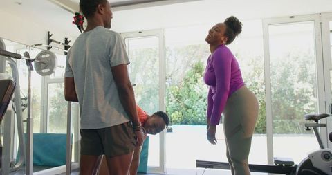Couple Discussing Workout in Home Gym with Enthusiasm