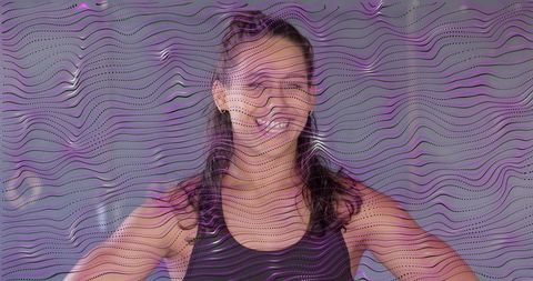 Hispanic female athlete smiling hands-on-hips black tank top fitness empowerment portrait