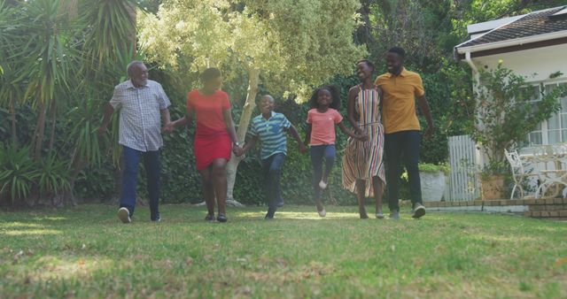 Happy Multigenerational Family Walking on Grass in Sunny Yard - Download Free Stock Images Pikwizard.com