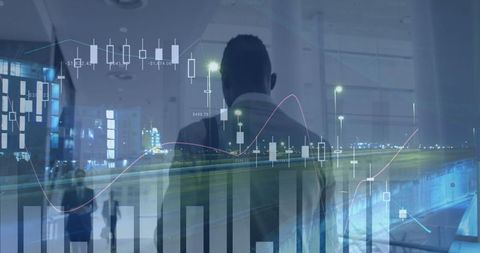 Businessman analyzing financial data with futuristic charts