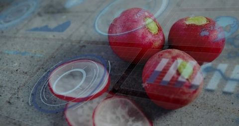 Displaying red radish cluster with sliced pieces on stone slab with digital hud overlays