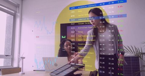 Business Professionals Analyzing Renewable Energy Data in Modern Office