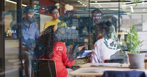 Innovative Team Discussing Global Strategy with Digital Map