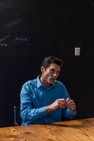 Professional businessman discussing profits in meeting room