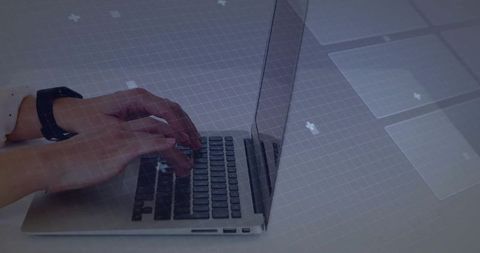 Modern workspace hands typing on laptop with digital interface