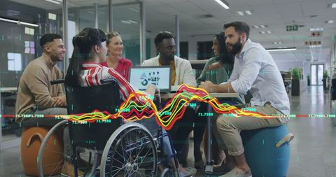 Diverse Team Meeting with Financial Data Visualization in Modern Office