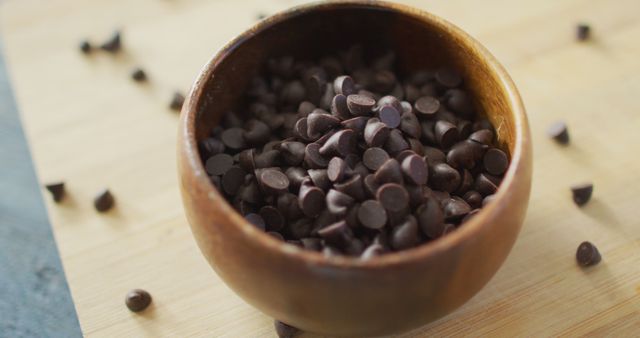 Bowl of Dark Chocolate Chips on Wooden Table - Download Free Stock Images Pikwizard.com