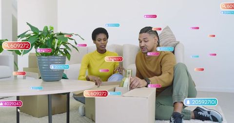 Couple unpacking boxes and arranging modern living room decor with wine bottle and plant