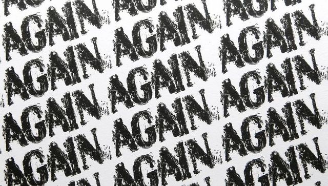 Repeating again stamp pattern with distressed ink texture and diagonal grunge typography