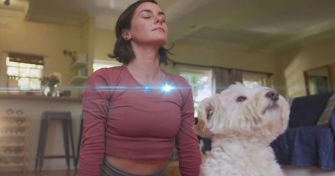Woman Meditates in Living Room with White Dog Promoting Mindful Living