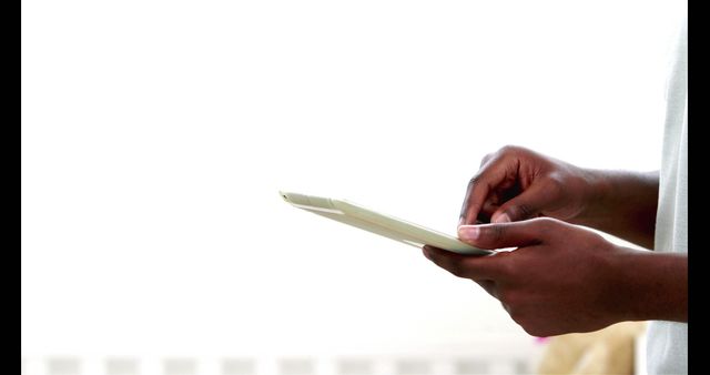 Close-up of hands using tablet, best for technology, digital communication, or gadget-related projects. Ideal for illustrating mobile device usage, dynamic gestures, and modern technology themes.