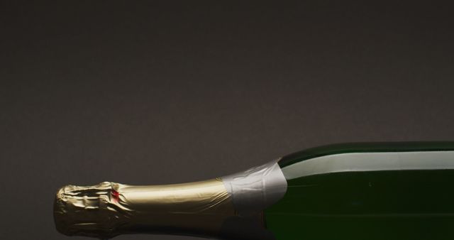 Close up of bottle of champagne on green background. studio shot, food autumn and celebration concept.