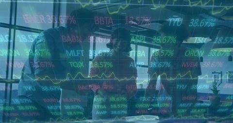 Business team collaborating over financial documents with stock market ticker overlay
