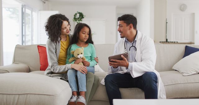 Doctor Visiting Mother and Daughter at Home - Download Free Stock Images Pikwizard.com