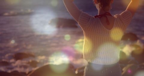 Woman Enjoying Sunset on Tranquil Rocky Beach - Download Free Stock Images Pikwizard.com