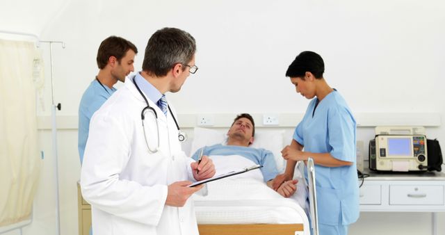 Medical Team Treating and Monitoring Patient in Hospital Room - Download Free Stock Images Pikwizard.com