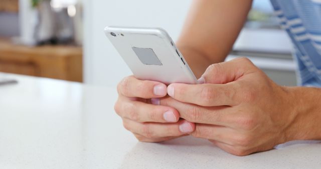 Close-up of Hands Using Smartphone in Modern Kitchen - Download Free Stock Images Pikwizard.com