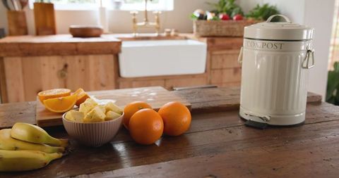 Eco-Friendly Kitchen with Compost Bin and Fresh Produce