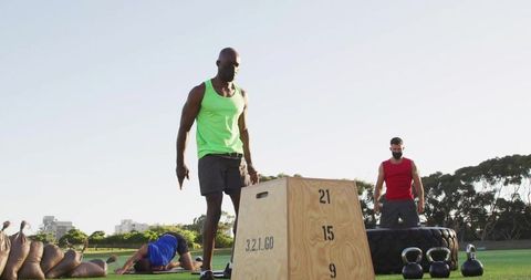 Athletic man engaged in outdoor strength training with plyometric box