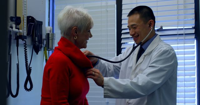 Doctor Examining Senior Woman With Stethoscope in Clinic - Download Free Stock Images Pikwizard.com