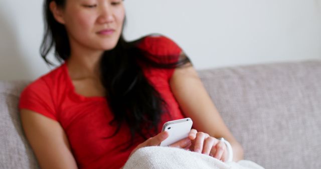 Woman using mobile phone in living room at home - Download Free Stock Photos Pikwizard.com