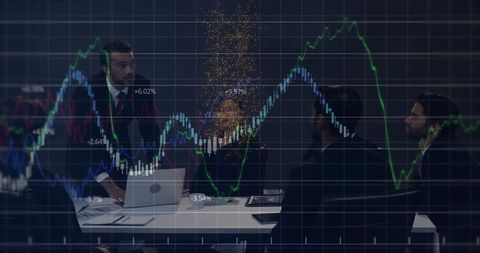 Business professionals analyzing financial graphs in modern meeting