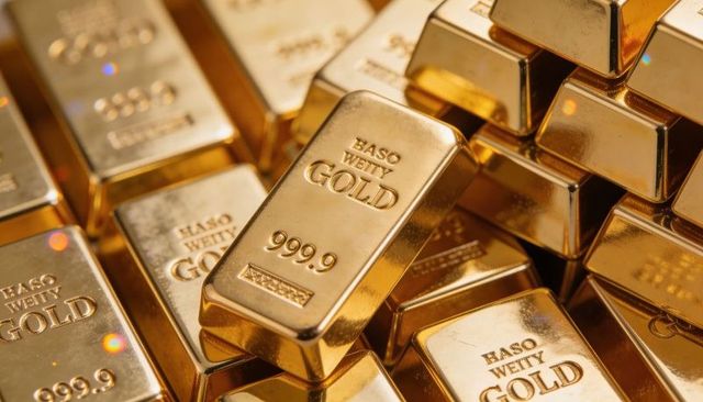 Stacked gleaming gold bullion bars with 999.9 purity mark reflective precious metal
