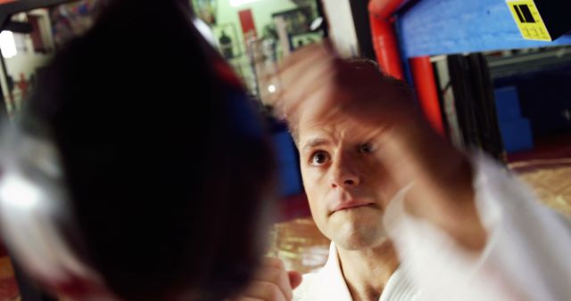 Focused Man Training on Punching Bag in Gym - Download Free Stock Images Pikwizard.com