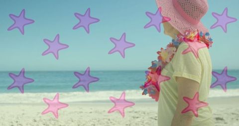 Senior Woman Enjoying Beach with Overlay of Falling Stars
